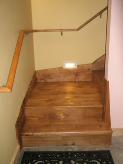 Handrail and stairway from the basement to the mainfloor with linseed oil-based Danish finish